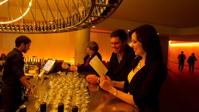 Couple ordering drinks from the Prosecco Bar