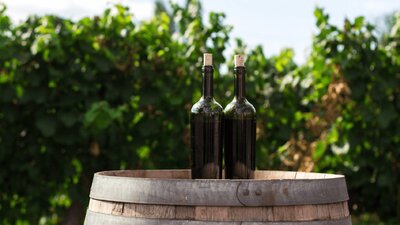 CGT Wine Tour - 2 bottles on a barrel