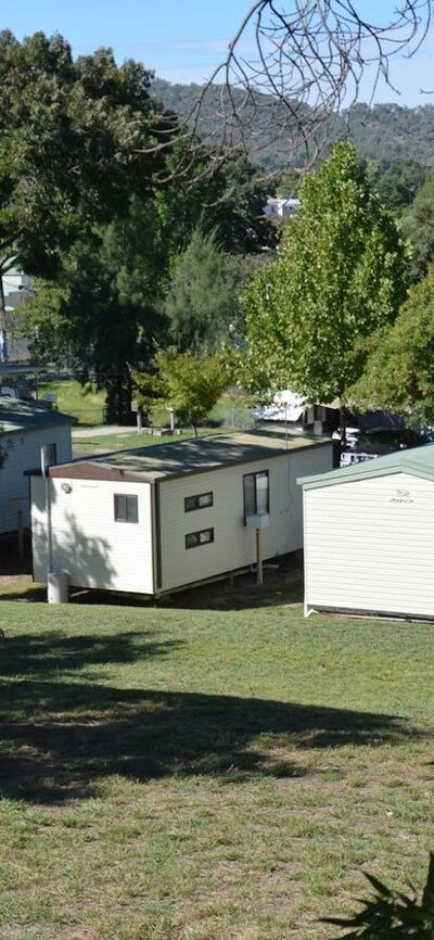 Adelong Golden Gully Caravan Park cabins from up the hill, looking towards the town of Adelong