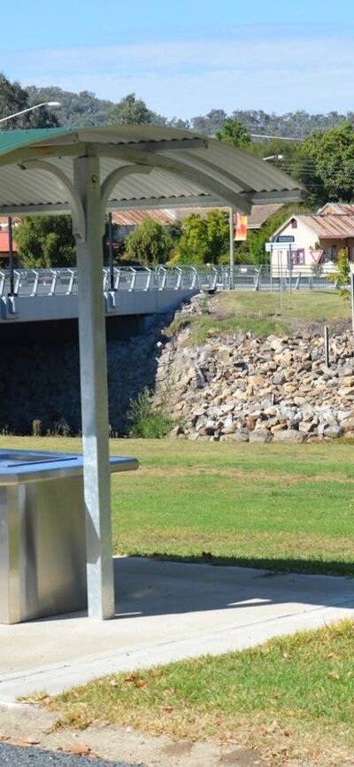 Barbeque area at Caravan park entrance, looking over creek towards the Royal Hotel