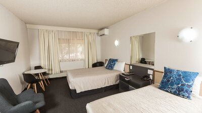 Our classic hotel room is a comfortable sized room with a queen & single bed