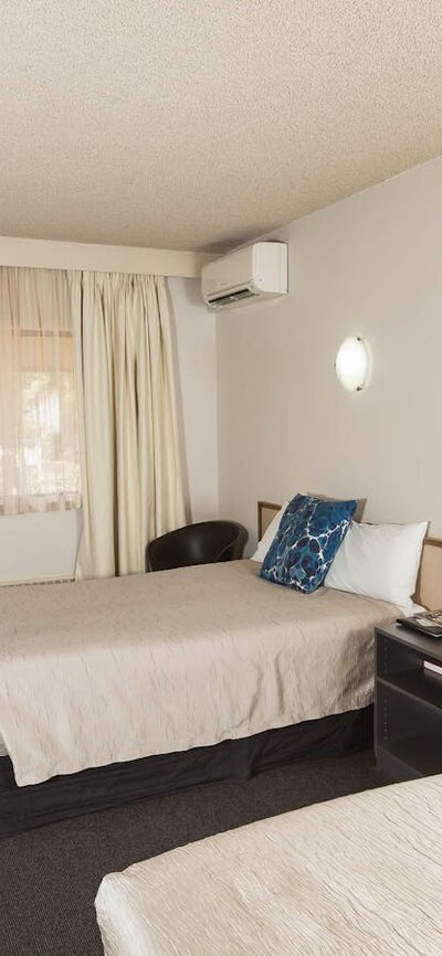 Our classic hotel room is a comfortable sized room with a queen & single bed