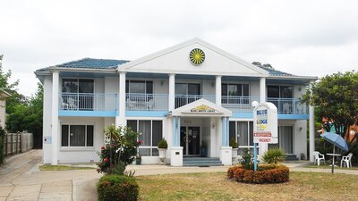 Blue and White Lodge exterior view from road