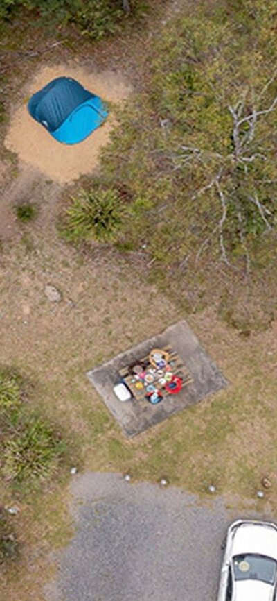 Aerial view of campsites and car spaces at Bungonia campground. Photo: John Spencer/DCCEEW &copy;