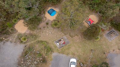 Aerial view of campsites and car spaces at Bungonia campground. Photo: John Spencer/DCCEEW &copy;