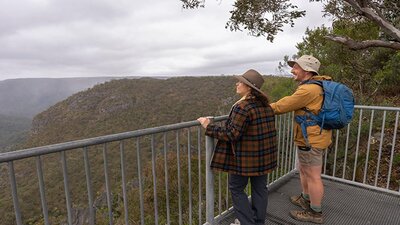 Visitors admiring the view from Adams lookout in Bungonia National Park. Photo: John Spencer/DCCEEW