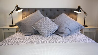 Bed with luxury cushions and linen