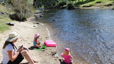 Children playing at one of the sandy river beaches at Elm Cottage