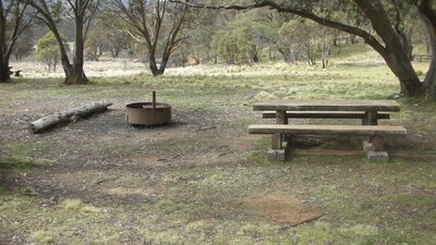 Photo of picnic table and fire pit