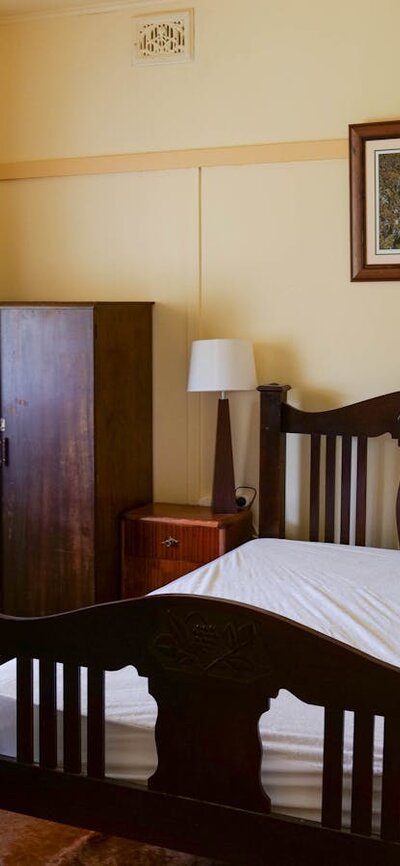 This room has one bed with a double-size mattress. Ready-Cut Cottage - Double-bed room