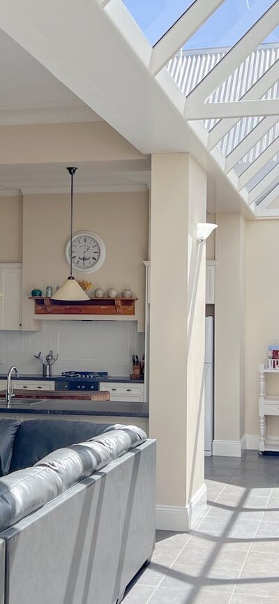 Large living area with a glass atrium roof