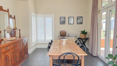 Dining room with sideboard, 8 chairs and record player with records