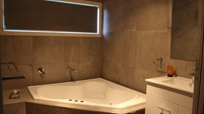 Corner spa bath in main bathroom