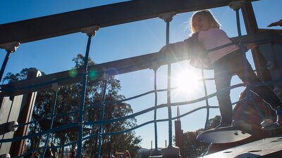 Girl on a moving bridge in the Boundless Playground