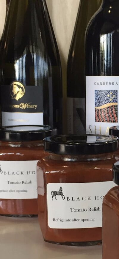 Local wines, relish and nuts on a stand