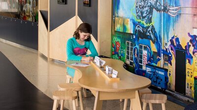 Child playing at a small table and chairs