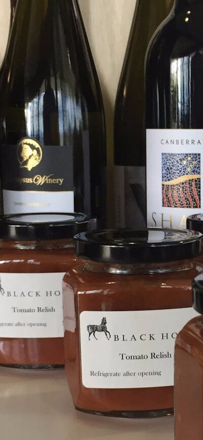 Local produce Local wines, relish and nuts on a stand