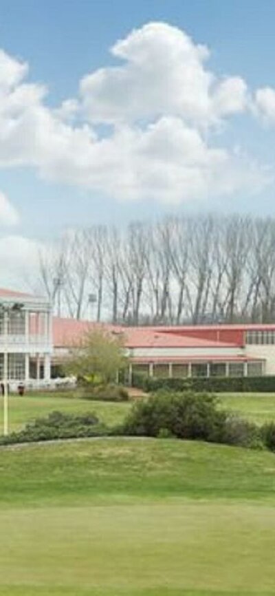 Wide view of Canberra International Golf Centre in the background and course in the foreground