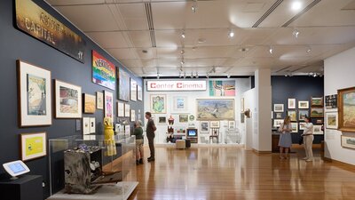 Exhibition image featuring people exploring the Canberra/Kamberri Exhibition