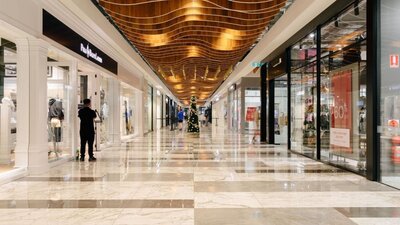 Corridor of shops at an outlet centre in Canberra.