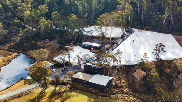 Corin Forest Drone View Corin Forest as seen by a drone. There are 3 large patches of snow & a small dam surrounded by trees