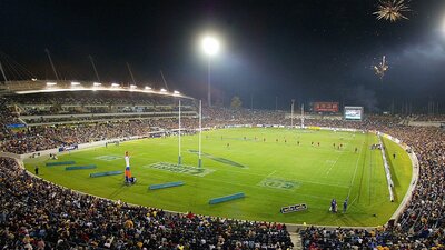 A packed stadium at night