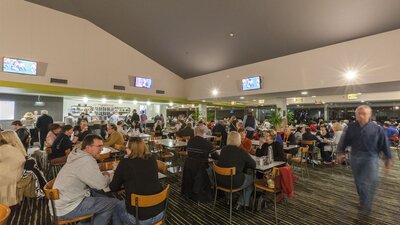 A busy bar area with lots of seating