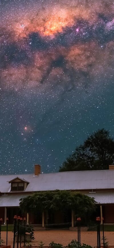 Lanyon Homestead at night with stars visible in the sky above