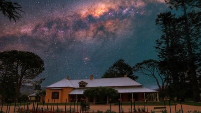 Lanyon Homestead at night with stars visible in the sky above