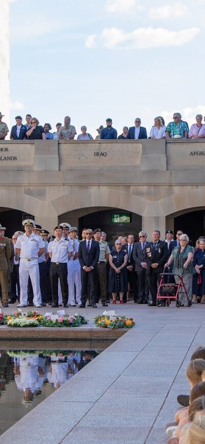 Last Post Ceremony at the Australian War Memorial A large group of people attending the Last Post Ceremony at the Australian War Memorial