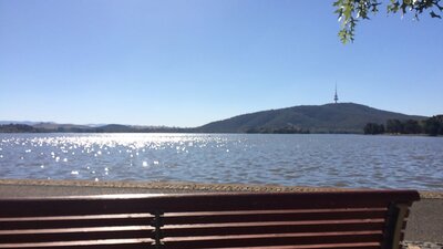 Park bench facing the lake with views of Black Mountain and Telstra Tower