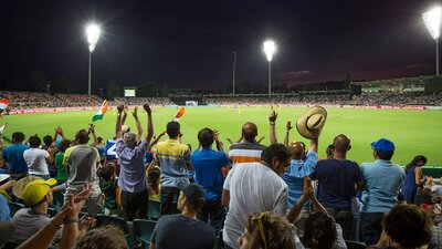 Cricket match under the lights at Manuka Oval