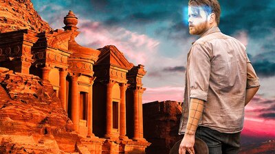 Man with a glowing VR headset looking at the ruins at Petra in an escape room