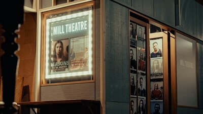 Outside the Mill Theatre, lightbox and doorway