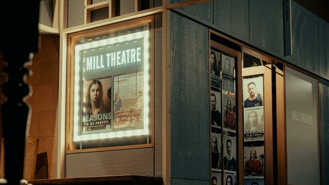 Outside the Mill Theatre, lightbox and doorway