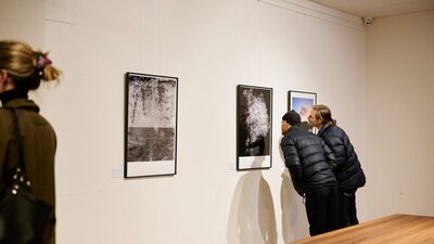 Visitors looking at work by Sammy Hawker