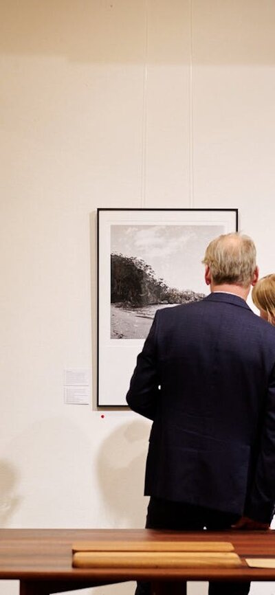 Visitors looking at work by Sammy Hawker