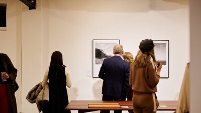 Visitors looking at work by Sammy Hawker