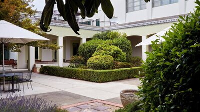 Courtyard with cafe tables and garden