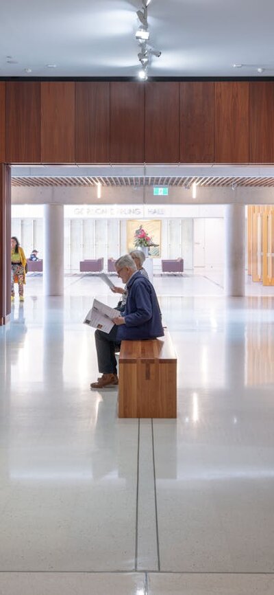 A photograph of Gallery 1 space featuring a salon hang of paintings