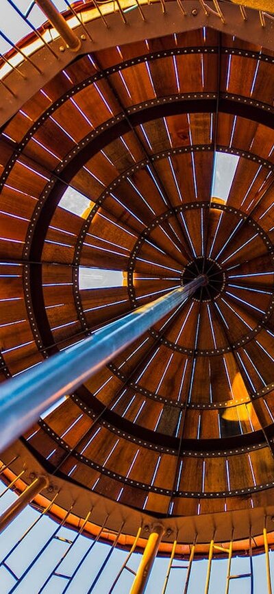 looking up from inside a playground acorn pod to see feature roof