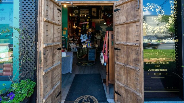 Witches, wizards, magical creatures and Muggles all welcome! Quizzic Alley's entrance, flanked by impressive timber castle doors.