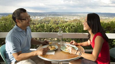 Couple eating outside with great views