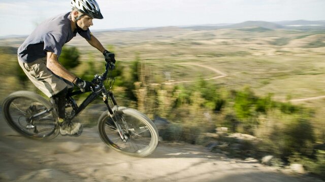 Stromlo Forest Park A man riding a mountain bike at Stromlo Forest Park