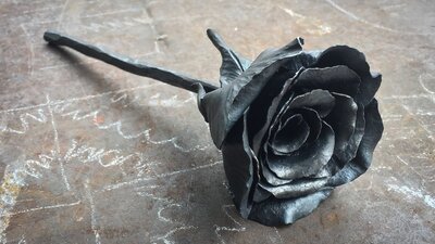 a steel rose made using decorative blacksmithing techniques