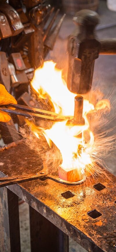 blacksmiths drifting a hammer head