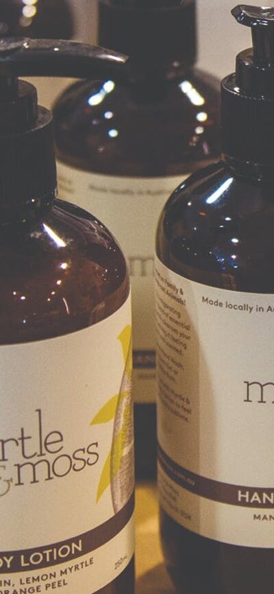 Pump bottles of Hand & Body lotion and wash made by Myrtle and Moss brand