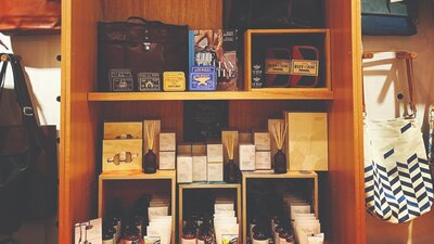 Shop Display including Myrtle and Moss hand creams, body products and reed diffusers; Men’s gifts