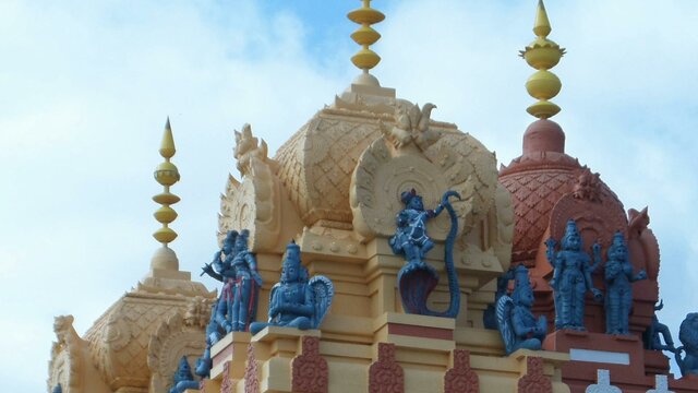 Statues and spires atop the Vishni Siva Mandir Temple and Library Statues and spires atop the Vishni Siva Mandir Temple and Library