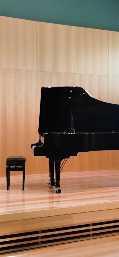 Stage of Mansfield Room with Yamaha Grand Piano and Harpsichord